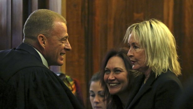 Chief state prosecutor Gerrie Nel talks with June Steenkamp, the mother of the late Reeva Steenkamp, in the Supreme Court of Appeal in Bloemfontein on Tuesday. 