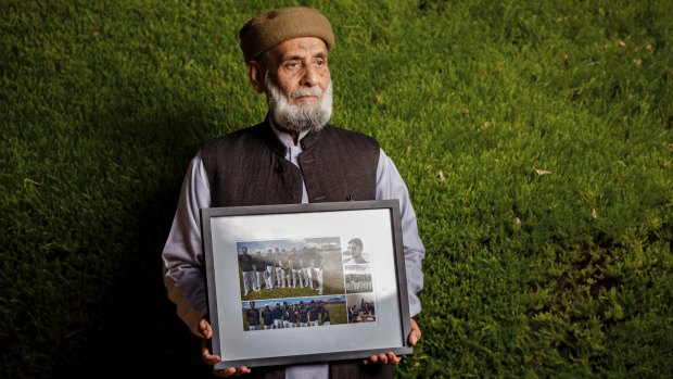 Muhammad Akbar Abbasi with photos of his son Zeeshan Akbar, who was tragically killed on April 7 while working at a service station in Queanbeyan.