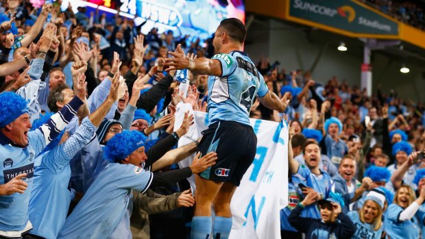 Pleasure and Hayne: Jarryd Hayne celebrates with Blues fans during game one.