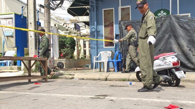 Investigators work at the scene of an explosion in the resort town of Hua Hin on Friday.