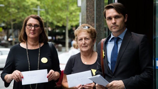 Anti-CSG protestors present letters to the Sydney office of Santos' new chief executive, Kevin Gallagher.