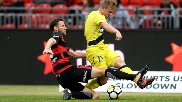 Fierce competitor: Robbie Cornthwaite tackles Connor Pain of the Mariners.