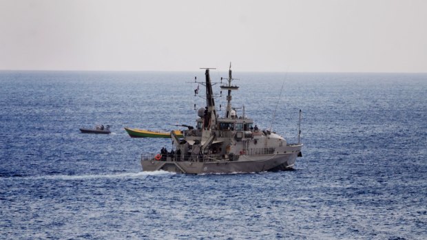 An Australian Naval vessel approaches a suspected refugee boat off the coast of Christmas Island.
