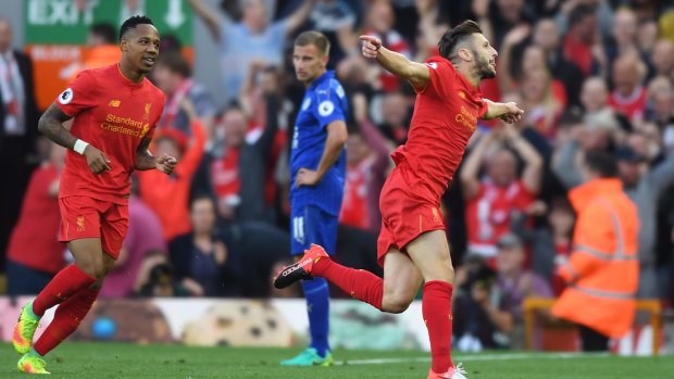 Impressive: Adam Lallana celebrates as Liverpool raced away to victory against champions Leicester City.