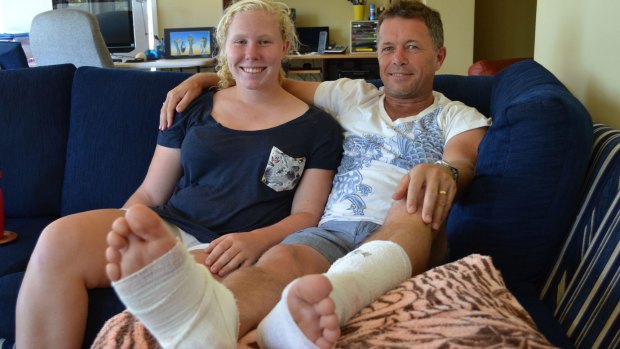 Rhianna Brown with her father Jeff at their Sanctuary Point home. Mr Brown was bitten by a shark on Monday morning.