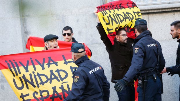 Protesters hold Spanish flags reading: "Long live a united Spain" outside the Supreme Court in Madrid on Thursday.