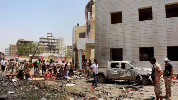 The bombing in Aden, claimed by Islamic State, killed more than 50 pro-government troops preparing to fight Houthi rebels in Yemen's north. 