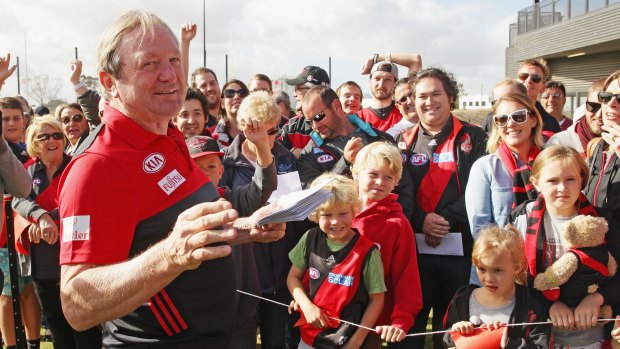 Kevin Sheedy handing out free tickets to Essendon fans on Thursday.