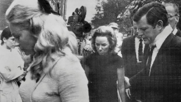 Edward Kennedy, with neck brace, with Robert Kennedy's widow Ethel at his immediate left and his wife Joan, at Mary Jo's funeral.