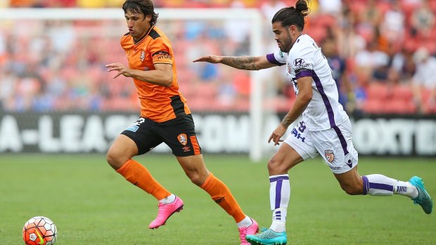 A-League restructure: Brisbane's Thomas Broich and Perth's Aryn Williams compete for the ball.