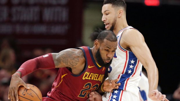 Star power: LeBron James drives past Ben Simmons in Cleveland.