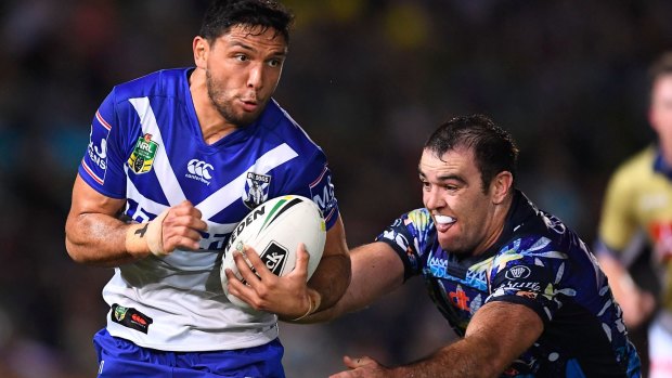 Curtis Rona of the Bulldogs is tackled by Kane Linnett of the Cowboys during the round 20 NRL match between Canterbury and North Queensland in Townsville last month.