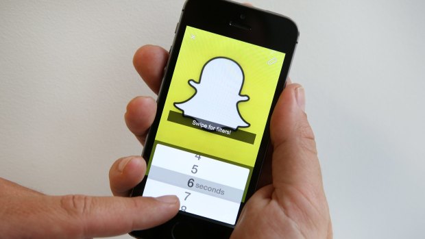 Message service begins weaving ads into users' Snapchats but promises it won't be 'rude'.