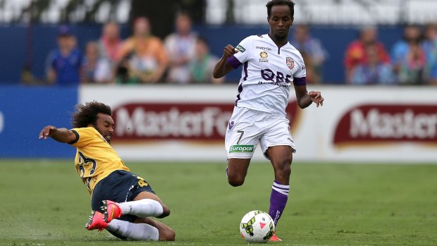 Welcome to Gosford: Isaka Cernak goes in hard on Perth’s Youssouf Hersi. 