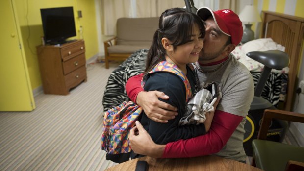 Arturo Hernandez Garcia, facing deportation, with his daughter in Denver in December.