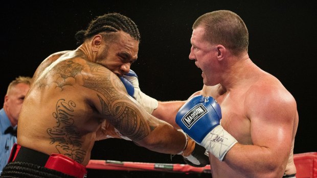 No holding back: Junior Paulo and Paul Gallen lock horns on Friday night.


durning their NRL Boxing fight at Moore Park on December 9, 2016 in Sydney.