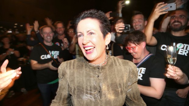 Supporters of Sydney lord mayor Clover Moore cheer her entrance on Saturday.