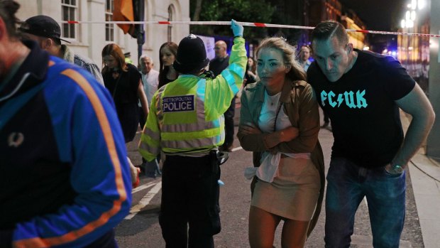 Members of the public are led away from the scene near London Bridge after the attack.