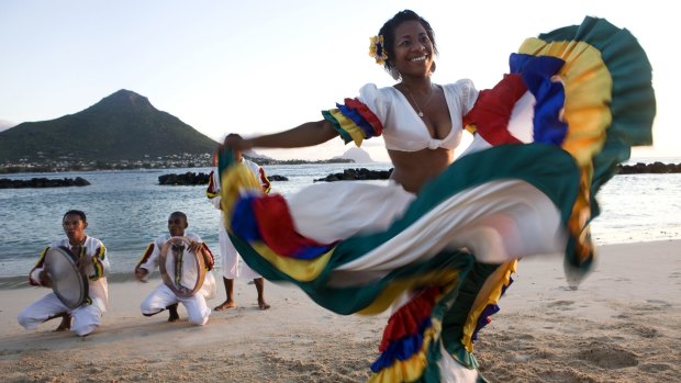 Segae dancer performs on a beach in Mauritius.