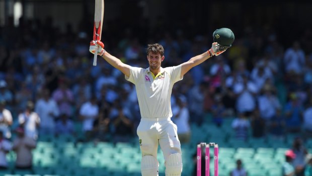 Run out averted: Mitch Marsh celebrates his hundred.