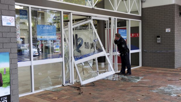 The aftermath of a ram raid of the Woolworths supermarket at the Calwell Shopping Centre.