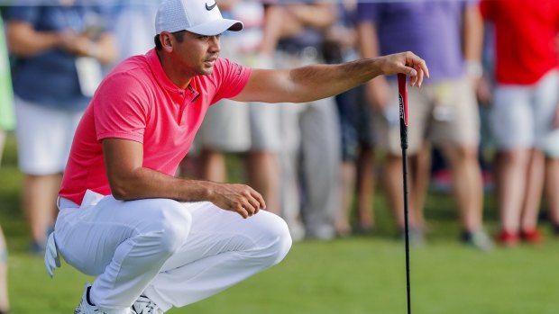 Tough start: Jason Day stuck back after dropping four shots in the first 13 holes.