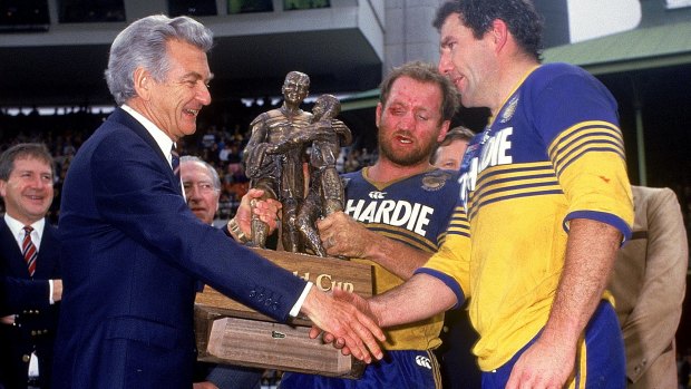 Bob Hawke congratulates Ray Price (centre) and Michael Cronin (right) of the Eels after the 1986 grand final.