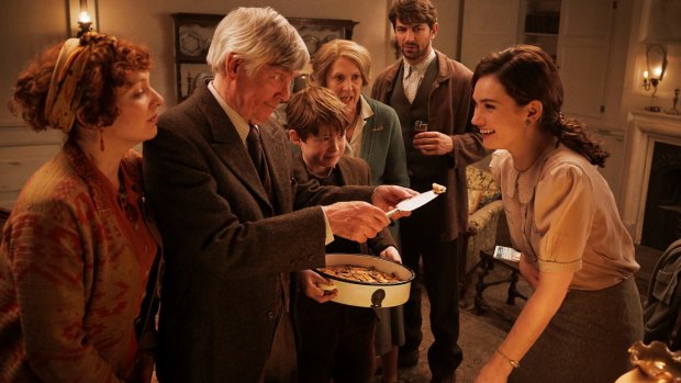 Lily James (right) as Juliet in a scene from the film The Guernsey Literary & Potato Peel Pie Society.