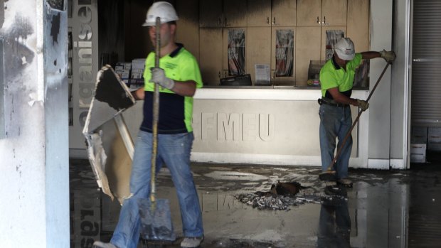 Arson attack: The clean-up at the CMFEU site at Lidcombe after the ram raid and fire in 2010.