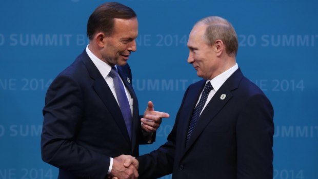 Tony Abbott welcomes Vladimir Putin to the G20 in Brisbane in September last year after threatening to shirt-front the Russian President.