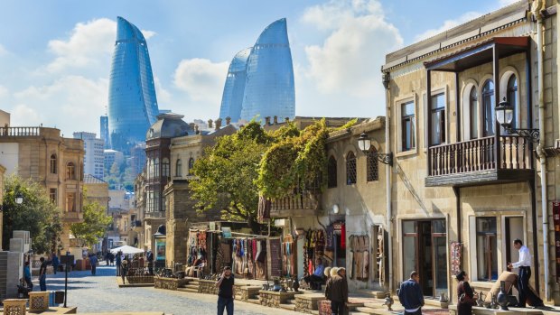 The inner city of Baku with the Flame Towers  in the background.