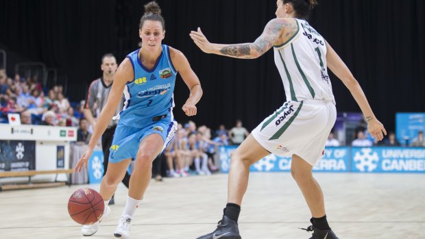 Stephanie Talbot of the Canberra Capitals drives the ball toward the net.