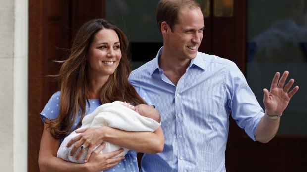 Britain's Prince William and Kate, Duchess of Cambridge hold their newborn son George in 2013. 