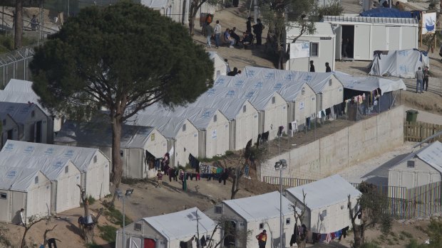 Migrants and refugees inside Moria camp on the Greek island of Lesbos, on Sunday.