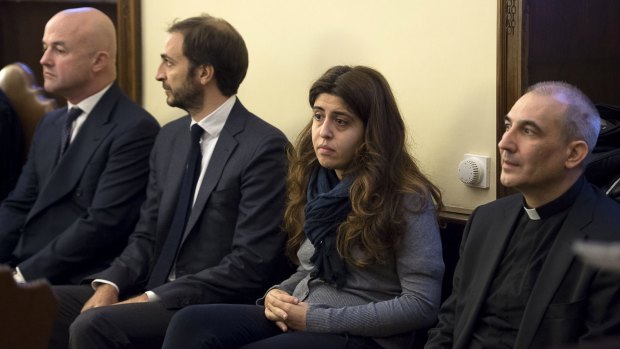 Spanish Monsignor Angel Lucio Vallejo Balda, far right, Chaouqui and journalists Emiliano Fittipaldi and Gianluigi Nuzzi (left) attend a trial at the Vatican.