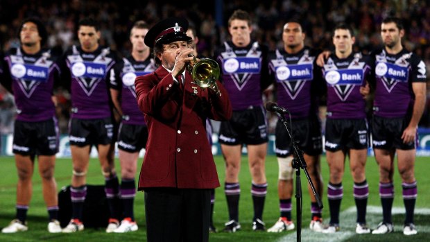 A bugler plays the Last Post before the start of the Anzac Day clash between Melbourne Storm and the Warriors at Olympic Park in 2009.