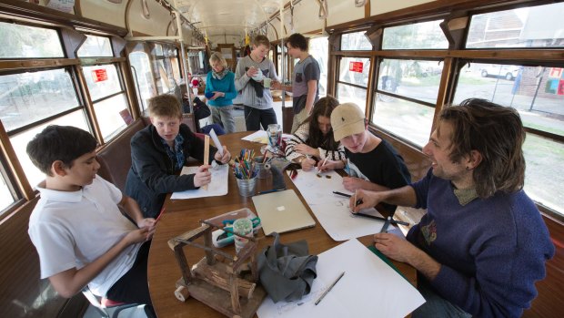 Fitzroy High School teachers Penelope stray and Michael Meneghetti 
working with students in their classroom, an old w class tram.
