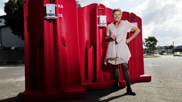CEO of Canberra CBD limited Jane Easthope with the portable urinals.