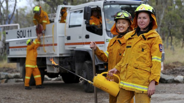 Hannah Burggraaff and Kaylea Boulter of the Southern ACT Bushfire Brigade. Firefighters will continue performing hazard reduction burns into winter and spring. 