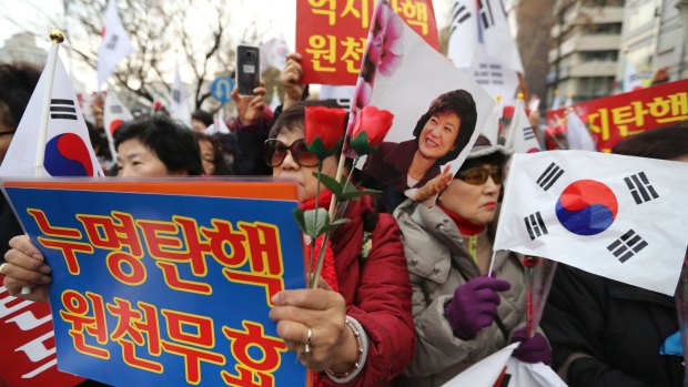 Supporters of South Korean President Park Geun-hye attend a rally near the Constitutional Court in Seoul.
