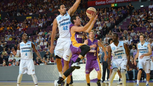 Power game: Sydney Kings guard Jason Cadee goes in for a lay-up against the NZ Breakers on Saturday night.