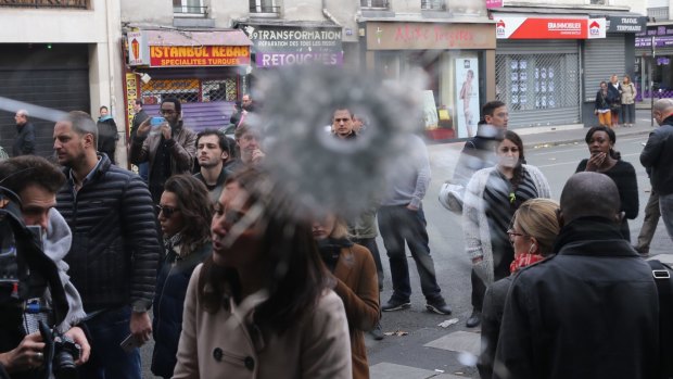 Bullet holes next to La Belle Equipe cafe in Paris, France.