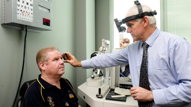 Mr Murray has his eyes checked by optometrist Dr Mark Feltham.