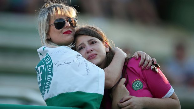 Chapecoense fans pay tribute to the victims at the club's Arena Conda stadium in Chapeco.