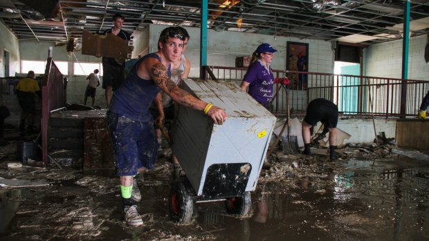 Photo taken on 14th January, 2011 at 9:48am
Friends and family get together to help with the clean up of Hoopers Carpet
One in the Ipswich CBD. The family business was devastated by flood waters
from the Bremer River.