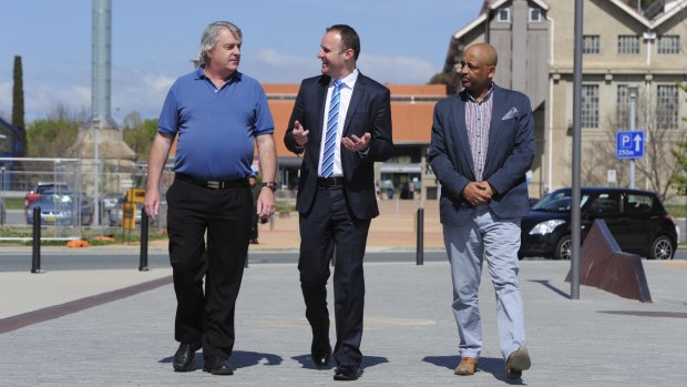 Signed up: Chief Minister Andrew Barr talks with future Uber drivers Gary Woodbridge and Teferi Gungl. 