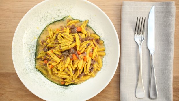 Saffron capunti pasta with ossobuco ragu and gremolata.