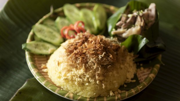 Yellow sticky rice with steamed free range chicken at Banh Cuon Ba Oanh.