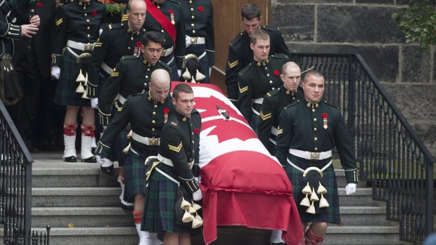 Pallbearers carry the coffin of Nathan Cirillo after his funeral service.