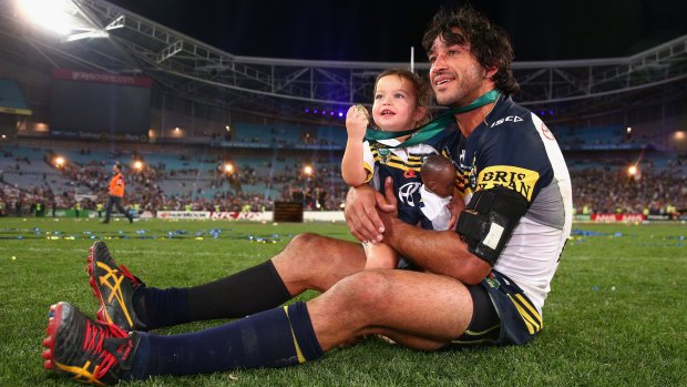 The moment: Johnathan Thurston with daughter Frankie after winning the 2015 NRL Grand Final.